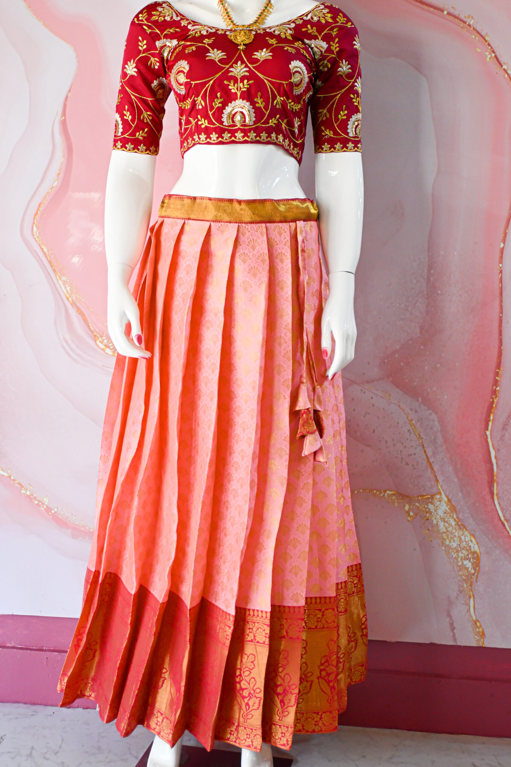 A traditional Indian Pattu Pavada (lehenga) in a vibrant Baby pink with dark Pink.
