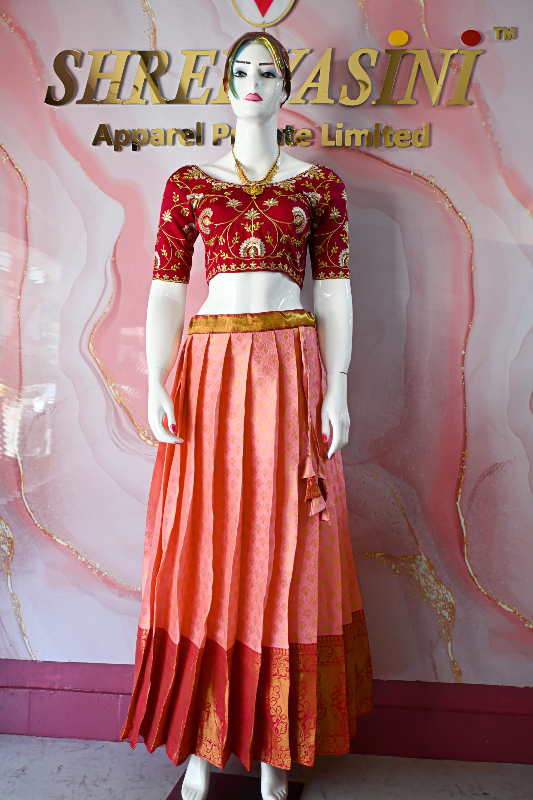 A traditional Indian Pattu Pavada (lehenga) in a vibrant Baby pink with dark Pink.