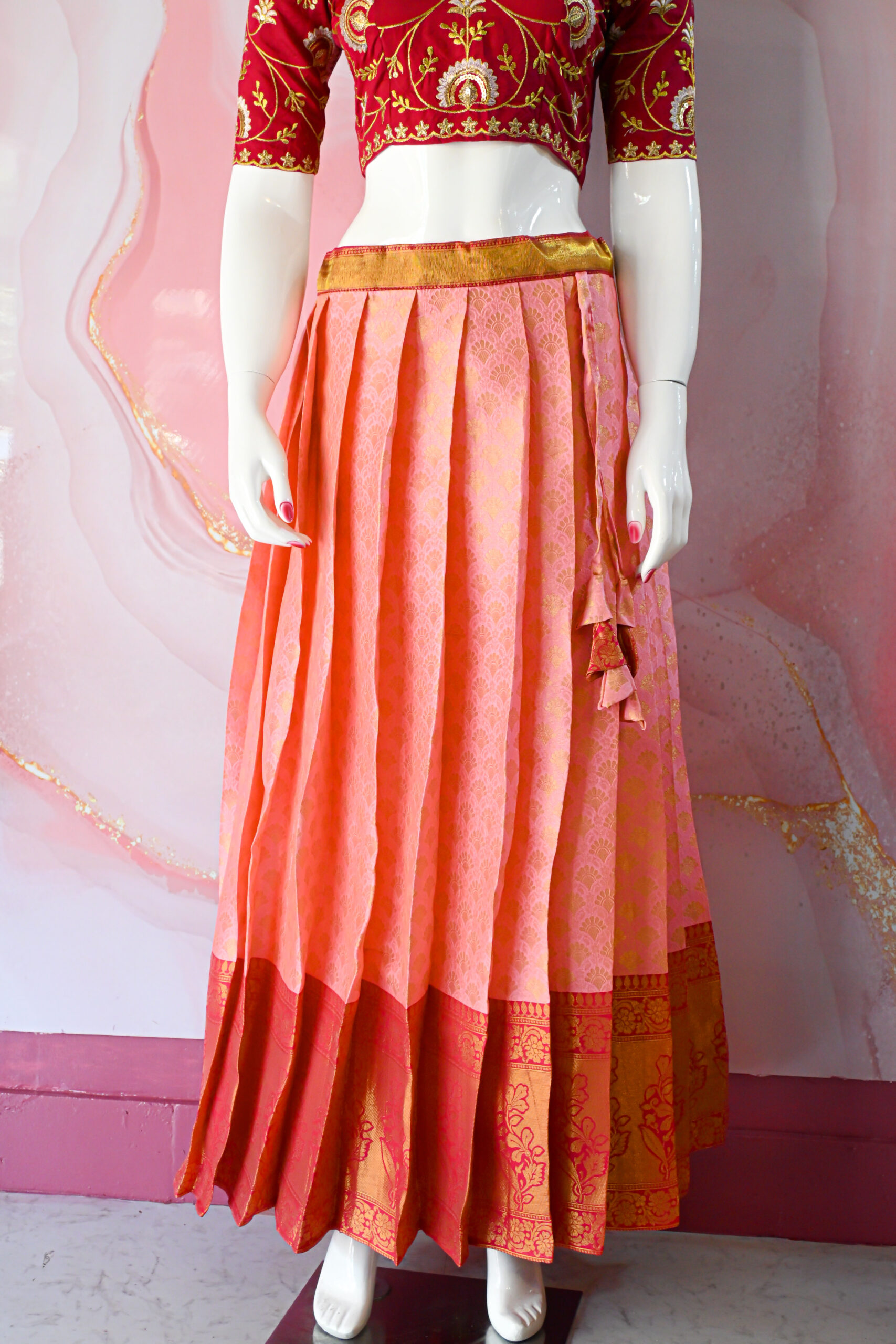 A traditional Indian Pattu Pavada (lehenga) in a vibrant Baby pink with dark Pink.