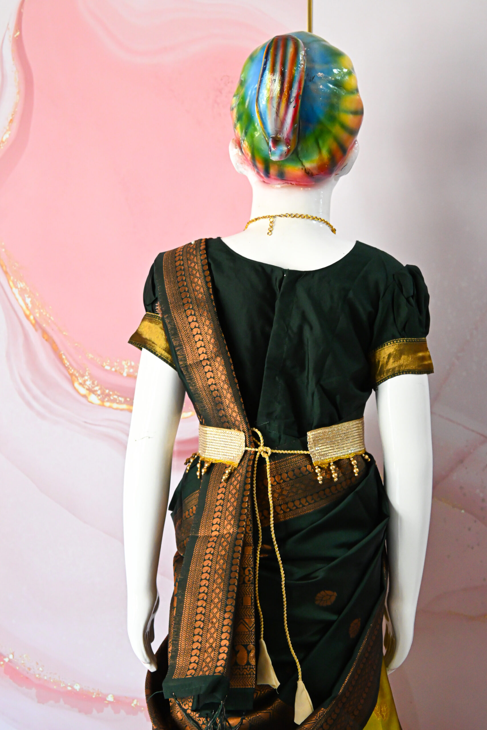 A traditional Indian Pattu Pavada lehenga in a Mustard Yellow with Green