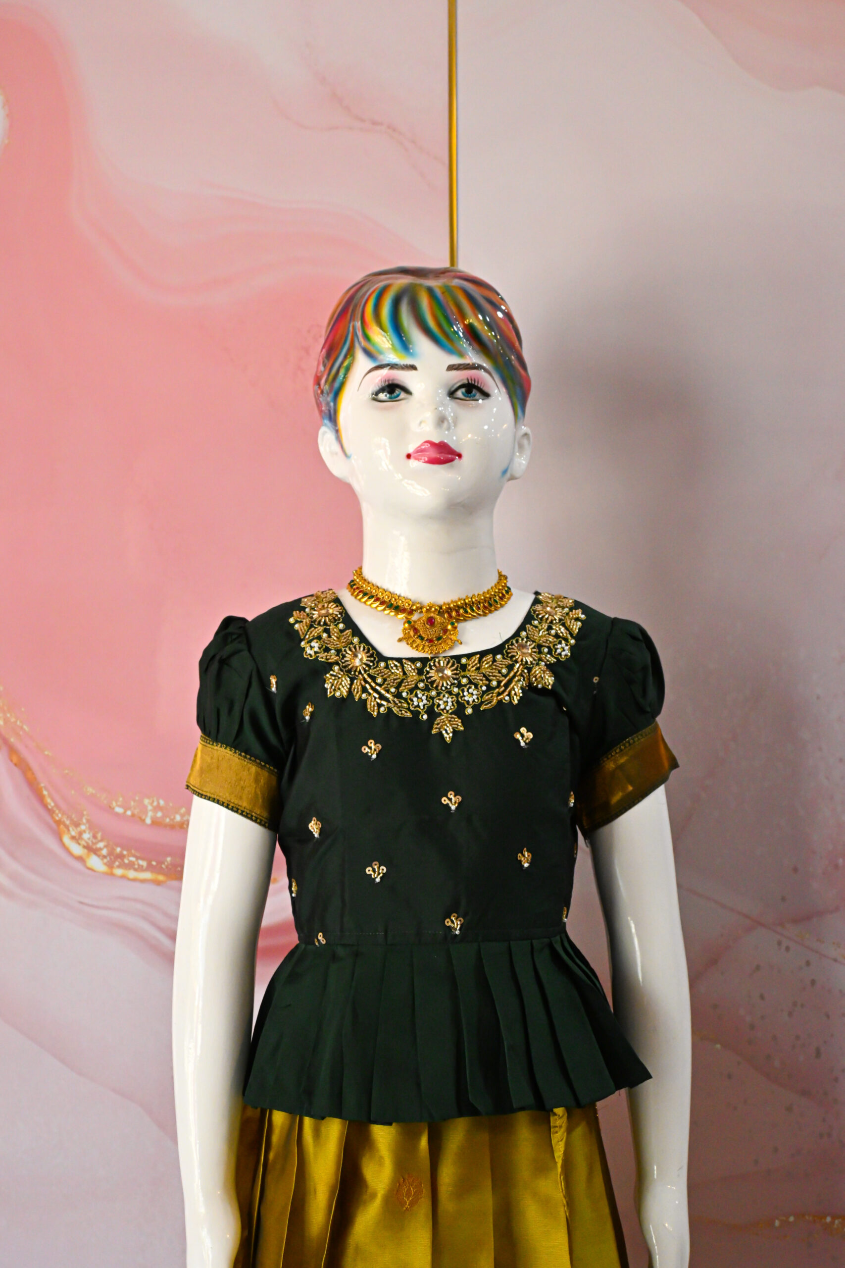 A traditional Indian Pattu Pavada lehenga in a Mustard Yellow with Green