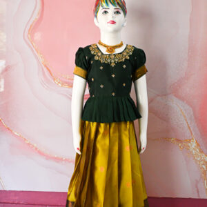 A traditional Indian Pattu Pavada lehenga in a Mustard Yellow with Green