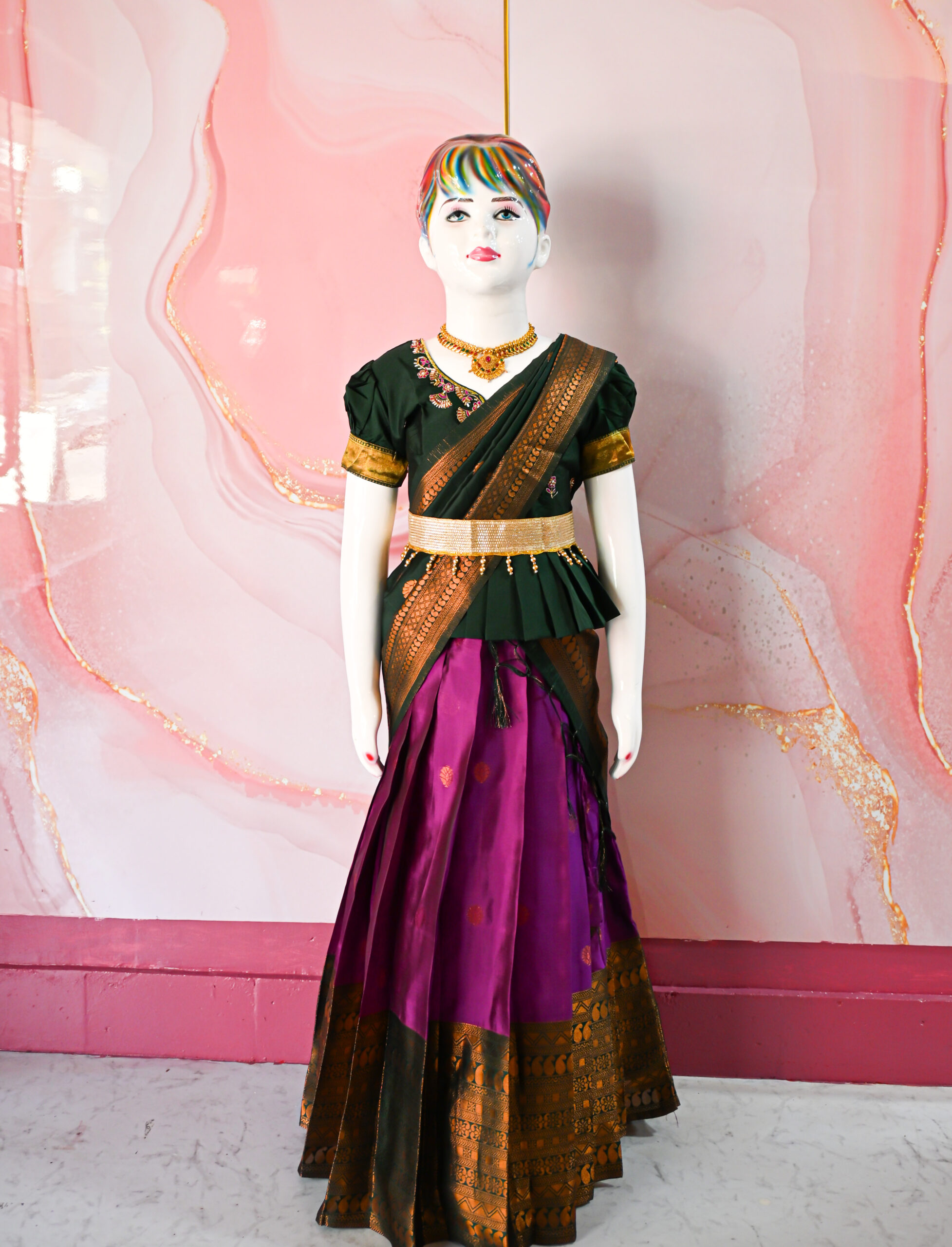 A traditional Indian Pattu Pavada (lehenga) in a vibrant Violet with forest Green.