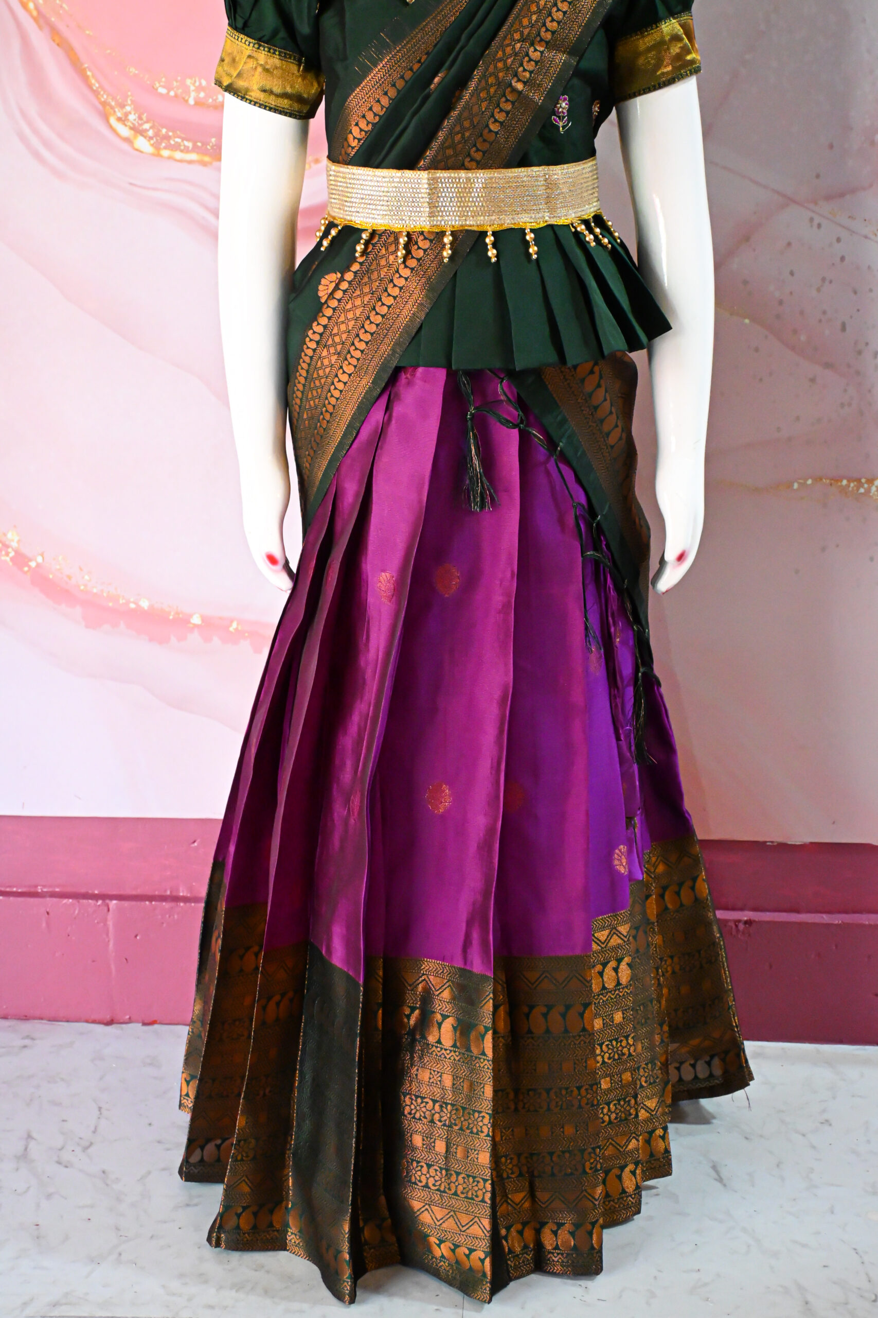 A traditional Indian Pattu Pavada (lehenga) in a vibrant Violet with forest Green.