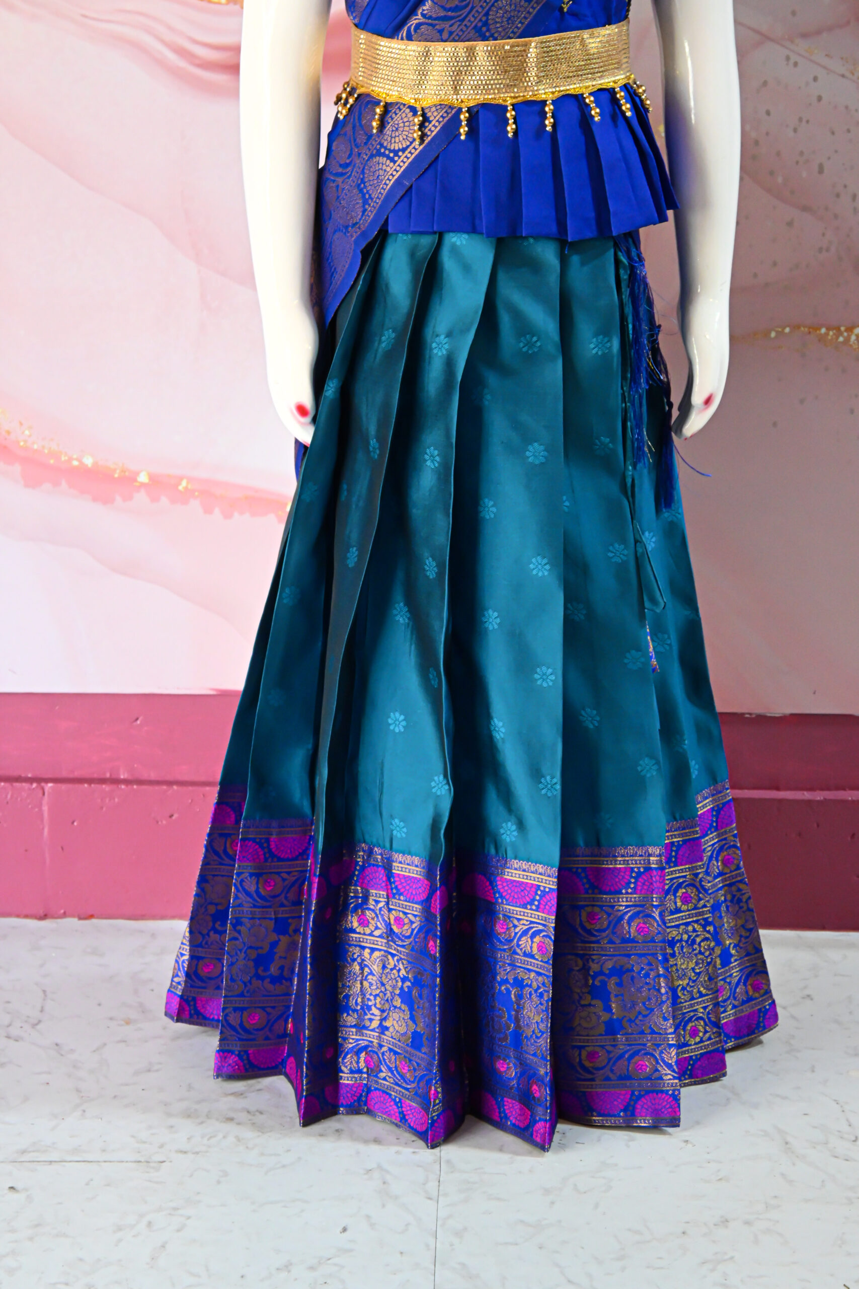A traditional Indian Pattu Pavada (lehenga) in a vibrant Teal Blue with Royal Blue.