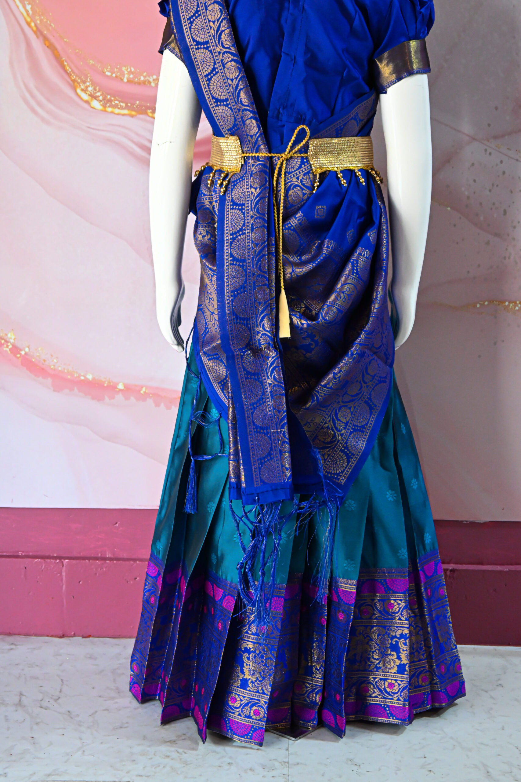 A traditional Indian Pattu Pavada (lehenga) in a vibrant Teal Blue with Royal Blue.