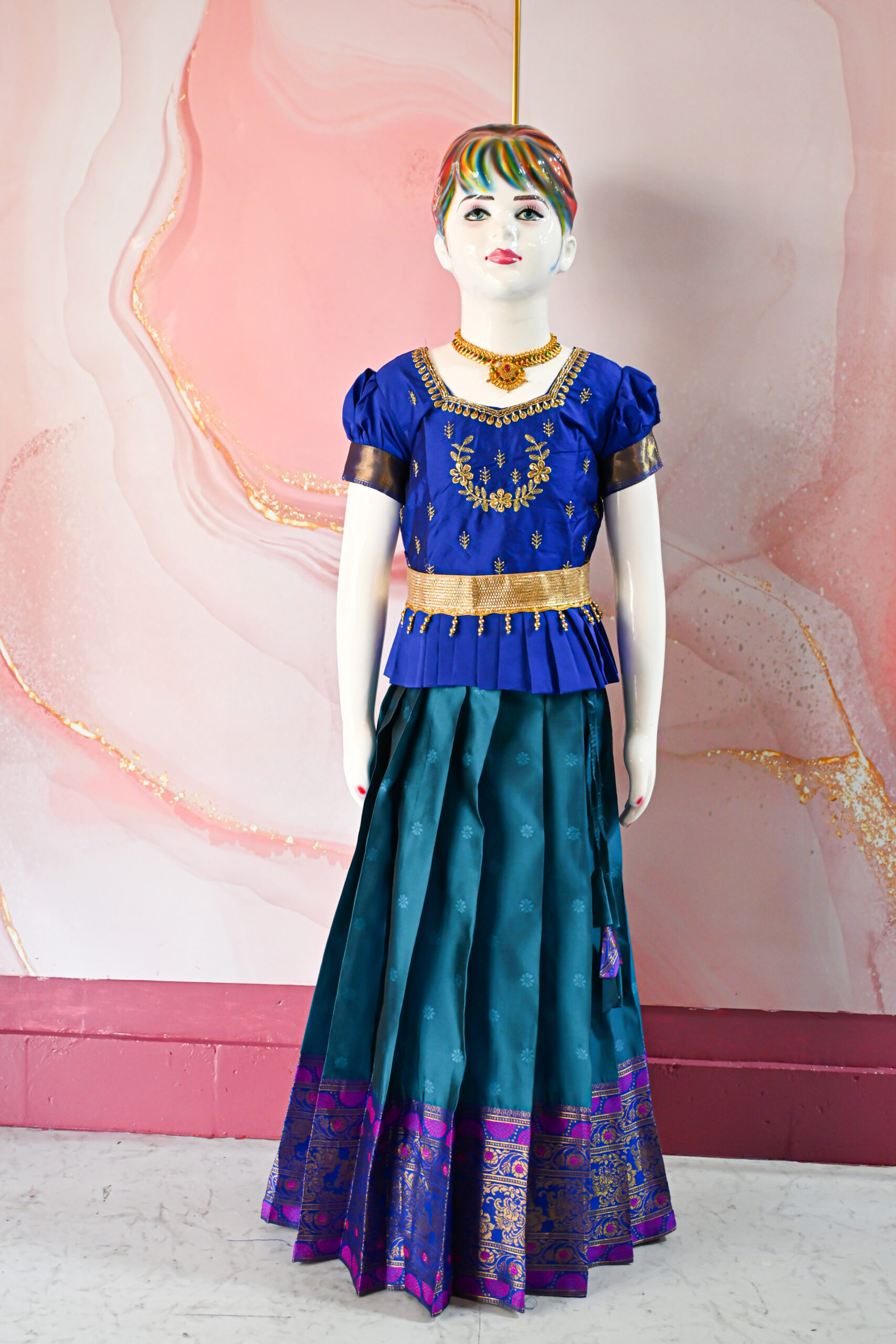 A traditional Indian Pattu Pavada (lehenga) in a vibrant Teal Blue with Royal Blue.