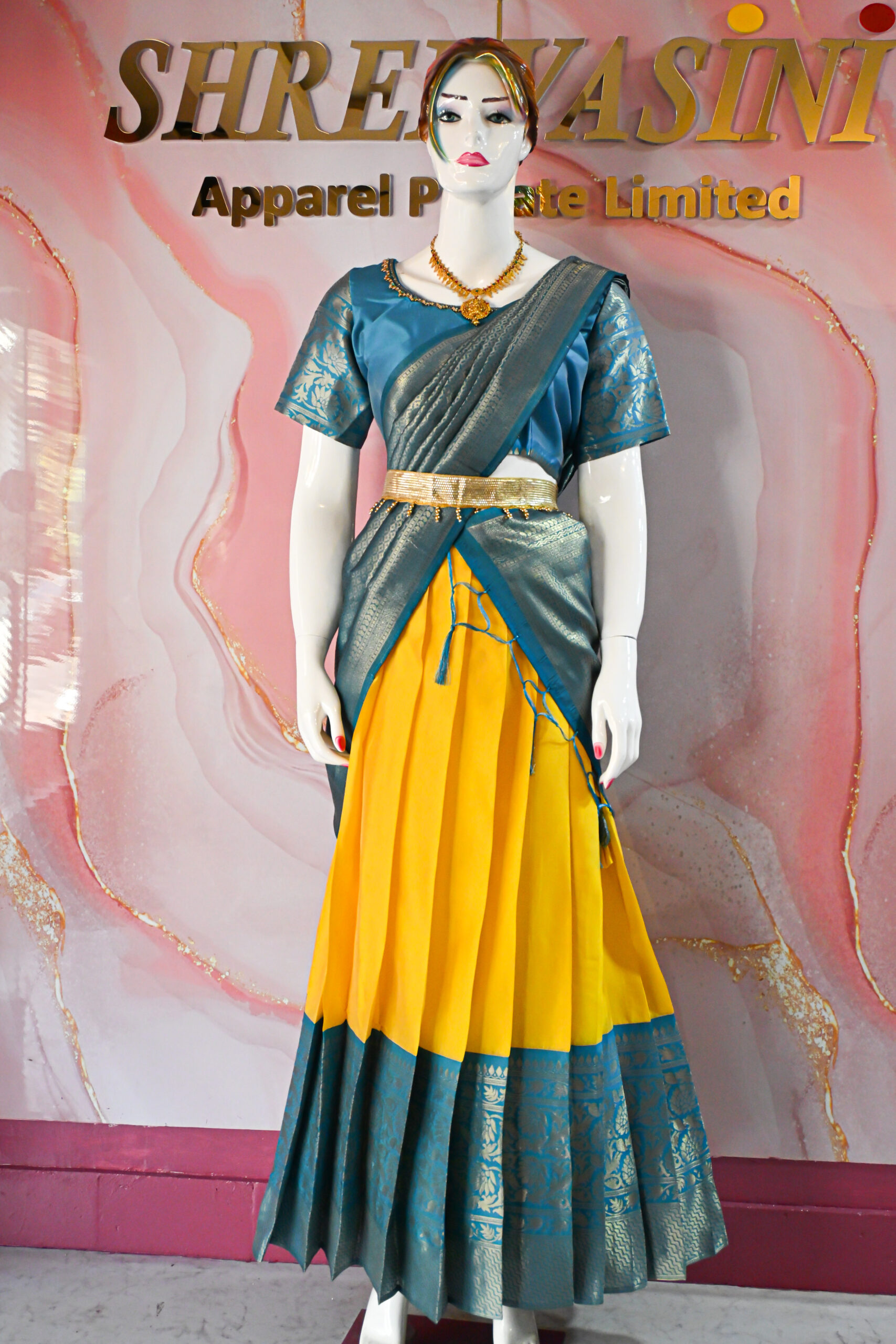 A traditional Indian Pattu Pavada (lehenga) in a vibrant Yellow with Blue.