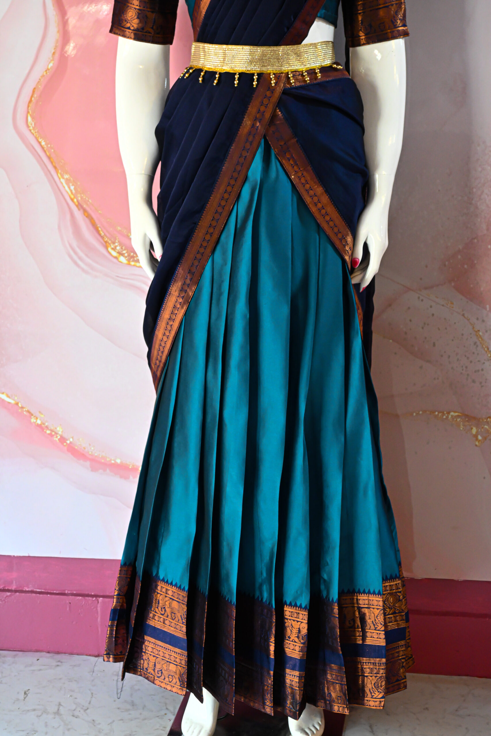 A traditional Indian Pattu Pavada (lehenga) in a vibrant ( Teal blue with navy Blue & Forest green with navy Blue )