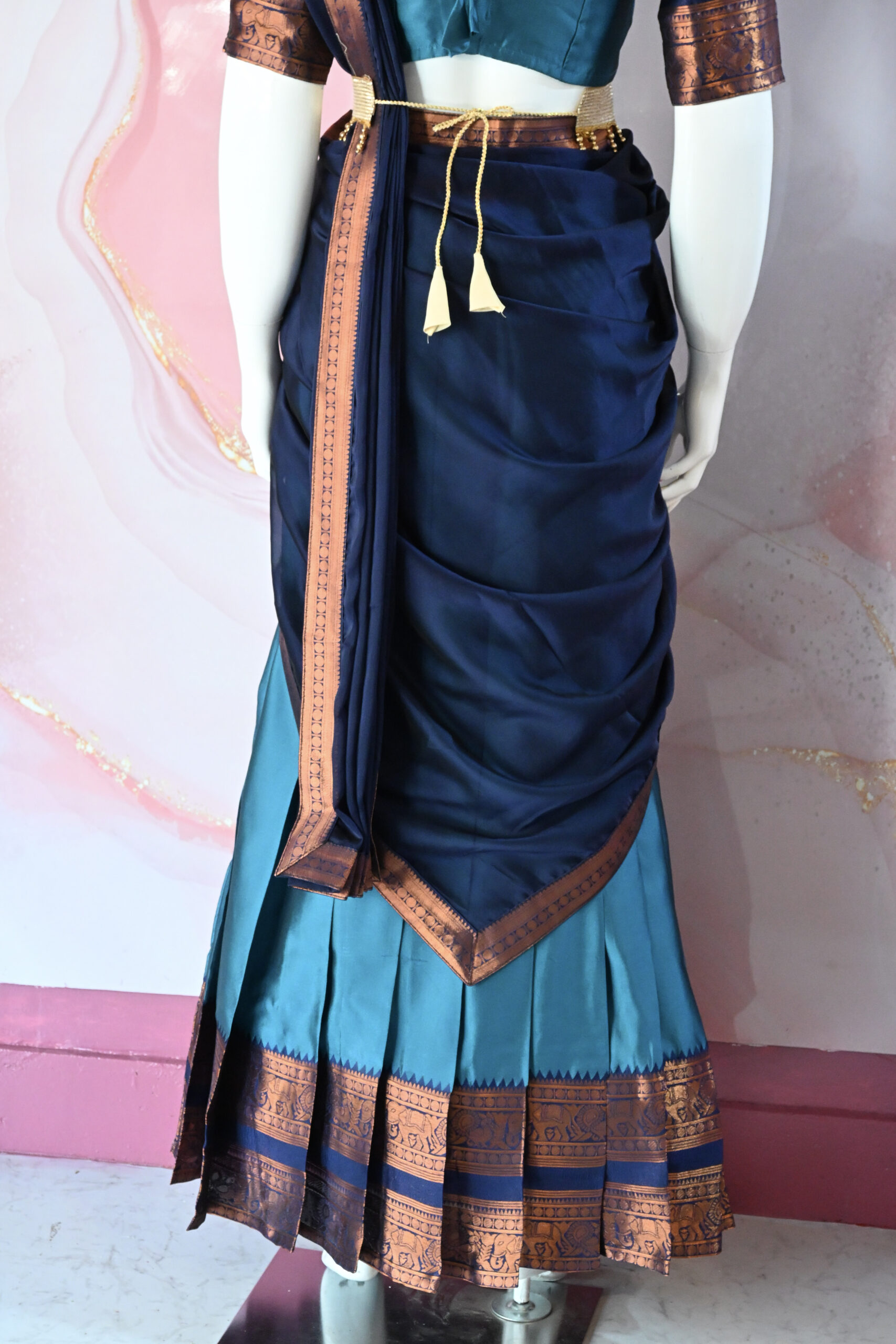 A traditional Indian Pattu Pavada (lehenga) in a vibrant ( Teal blue with navy Blue & Forest green with navy Blue )