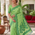 A soft, elegant pistachio green body contrasted by a vibrant dark green border and floral motifs.